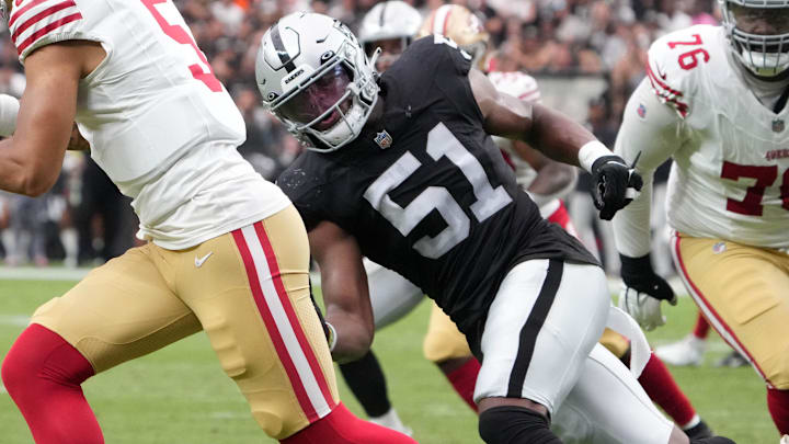 Aug 13, 2023; Paradise, Nevada, USA; San Francisco 49ers quarterback Trey Lance (5) is pressured by Las Vegas Raiders defensive end Malcolm Koonce (51) in the first half at Allegiant Stadium. Mandatory Credit: Kirby Lee-Imagn Images