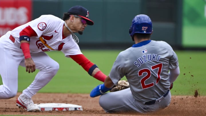 Jul 14, 2024; St. Louis, Missouri, USA;  St. Louis Cardinals shortstop Masyn Winn (0) tags out Chicago Cubs right fielder Seiya Suzuki (27) during the fourth inning at Busch Stadium
