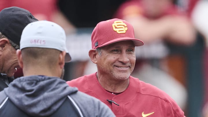 May 31, 2025; Corvallis, OR, USA; USC head coach Andy Stankiewicz visits with official before a game against Saint Mary's at the NCAA Corvallis Regional at Goss Stadium. 