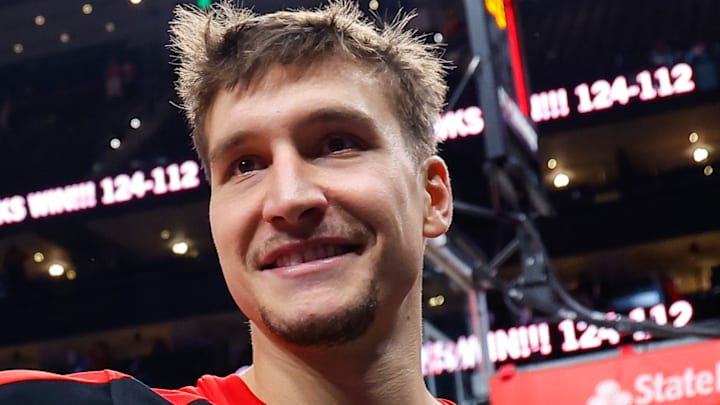Bogdan Bogdanovic #15 of the Atlanta Hawks waves to fans after beating the New Orleans Pelicans.