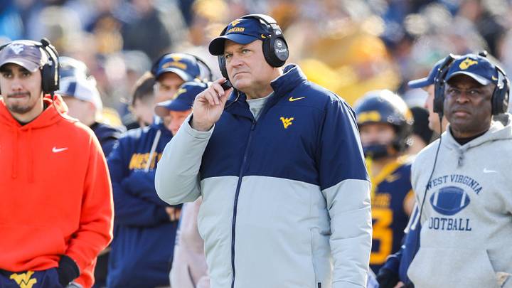 Nov 29, 2025; Morgantown, West Virginia, USA; West Virginia Mountaineers head coach Rich Rodriguez along the sidelines during the first quarter against the Texas Tech Red Raiders at Milan Puskar Stadium. Mandatory Credit: Ben Queen-Imagn Images
