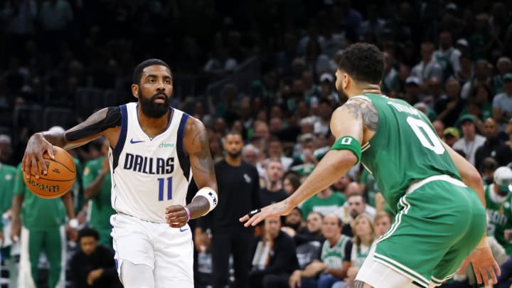 Jun 17, 2024; Boston, Massachusetts, USA; Dallas Mavericks guard Kyrie Irving (11) dribbles the ball against Boston Celtics forward Jayson Tatum (0) during the second quarter in game five of the 2024 NBA Finals at TD Garden. Mandatory Credit: Peter Casey-USA TODAY Sports