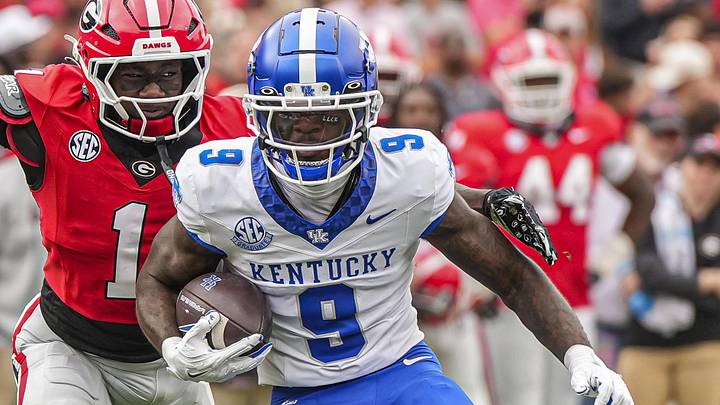 Oct 4, 2025; Athens, Georgia, USA; Kentucky Wildcats wide receiver Ja'Mori Maclin (9) runs against Georgia Bulldogs defensive back Ellis Robinson IV (1) during the first half at Sanford Stadium. Mandatory Credit: Dale Zanine-Imagn Images