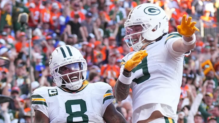 Green Bay Packers running back Josh Jacobs (8) and wide receiver Christian Watson (9) react after Jacobs' touchdown at Denver.