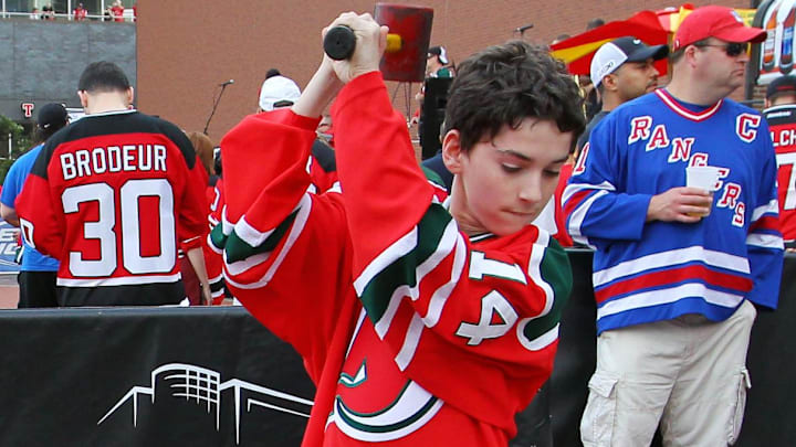 May 25, 2012; Newark, NJ, USA; A young fan hits a New York Rangers logo before game six of the 2012 Eastern Conference Finals at the Prudential Center. Mandatory Credit: Ed Mulholland-Imagn Images May 25, 2012; Newark, NJ, USA; A young fan hits a New York Rangers logo before game six of the 2012 Eastern Conference Finals at the Prudential Center. Mandatory Credit: Ed Mulholland-Imagn Images