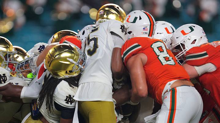 Aug 31, 2025; Miami Gardens, Florida, USA; Miami Hurricanes running back CharMar Brown (6) scores a touchdown against the Notre Dame Fighting Irish during the third quarter at Hard Rock Stadium.