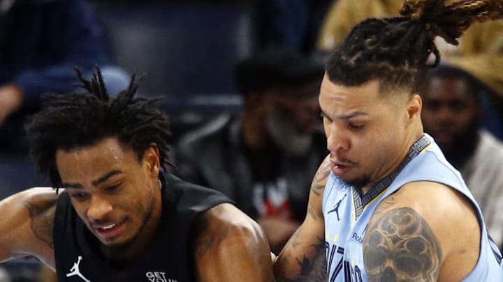 Brooklyn Nets center Nic Claxton loses control of the ball as Memphis Grizzlies forward Brandon Clarke defends Brooklyn Nets center Nic Claxton loses control of the ball as Memphis Grizzlies forward Brandon Clarke defends