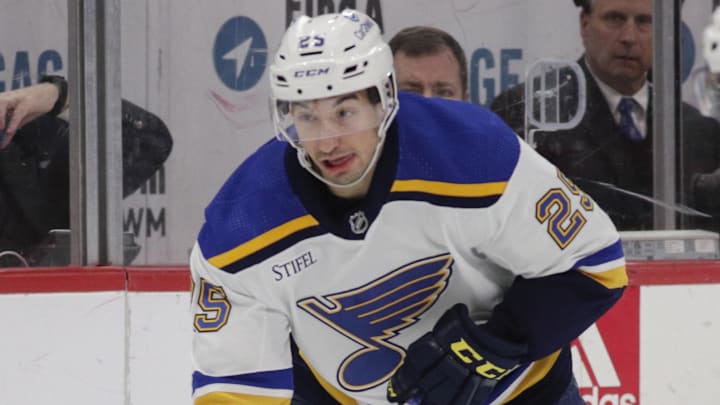 Mar 23, 2023; Detroit, Michigan, USA; St. Louis Blues center Jordan Kyrou (25) handles the puck against the Detroit Red Wings during the first period of the game at Little Caesars Arena. Mandatory Credit: Brian Bradshaw Sevald-Imagn Images