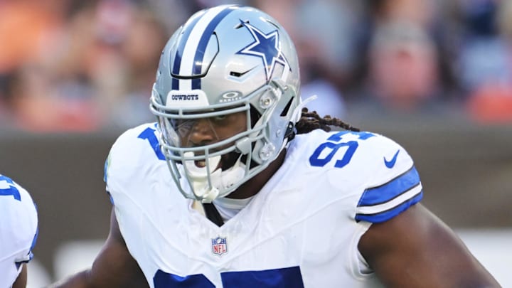 Sep 8, 2024; Cleveland, Ohio, USA; Dallas Cowboys linebacker Micah Parsons (11) celebrates with defensive tackle Osa Odighizuwa (97) after a sack during the first quarter against the Cleveland Browns at Huntington Bank Field. Mandatory Credit: Ken Blaze-Imagn Images