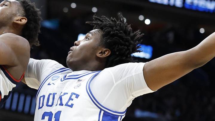 Mar 29, 2026; Washington, DC, USA; UConn Huskies forward Tarris Reed Jr. (5) loses the ball as he goes to the basket against Duke Blue Devils center Patrick Ngongba (21)in the second half during an Elite Eight game of the East Regional of the men's 2026 NCAA Tournament at Capital One Arena. Mandatory Credit: Amber Searls-Imagn Images Mar 29, 2026; Washington, DC, USA; UConn Huskies forward Tarris Reed Jr. (5) loses the ball as he goes to the basket against Duke Blue Devils center Patrick Ngongba (21)in the second half during an Elite Eight game of the East Regional of the men's 2026 NCAA Tournament at Capital One Arena. Mandatory Credit: Amber Searls-Imagn Images