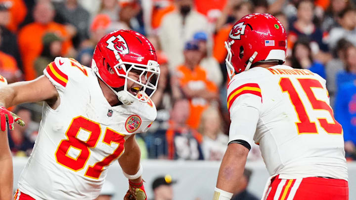 Nov 16, 2025; Denver, Colorado, USA; Kansas City Chiefs tight end Travis Kelce (87) celebrates his touchdown with quarterback Patrick Mahomes (15) and tight end Robert Tonyan (85) in the fourth quarter at Empower Field at Mile High. Mandatory Credit: Ron Chenoy-Imagn Images