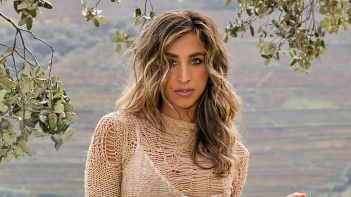 Katie Austin was photographed by Ben Watts in Portugal. Swimsuit by Andi Bagus. Top by Natalia Fedner. 