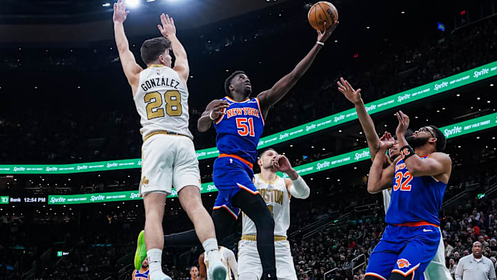 Feb 8, 2026; Boston, Massachusetts, USA; New York Knicks forward Mohamed Diawara (51) shoots the ball against Boston Celtics guard Hugo Gonzalez (28) in the first half at TD Garden. Mandatory Credit: David Butler II-Imagn Images