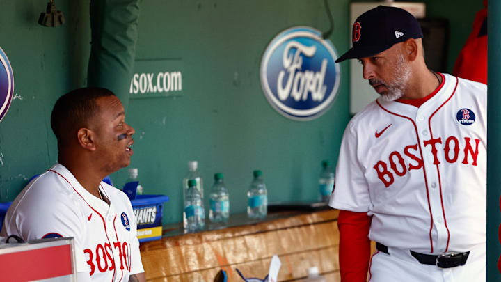 Boston Red Sox DH Rafael Devers, manager Alex Cora