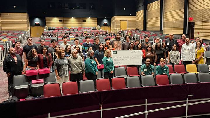 Oct 26, 2026; San Antonio, Texas, USA; San Antonio Spurs shooting guard Devin Vassell (24) poses for a photo with the varsity basketball teams at Harlandale High School during a surprise appearance in the school's auditorium.