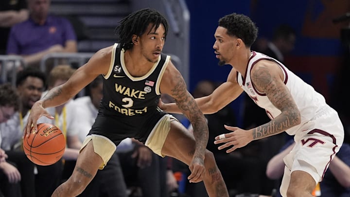 Mar 10, 2026; Charlotte, NC, USA; Wake Forest Demon Deacons forward Juke Harris (2) handles the ball guarded by Virginia Tech Hokies guard Jailen Bedford (0) during the first half at Spectrum Center. Mandatory Credit: Jim Dedmon-Imagn Images