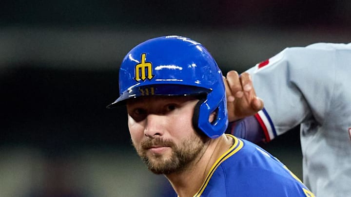 Seattle Mariners catcher Cal Raleigh (29) and Texas Rangers second baseman Marcus Semien (2) look to first on a double play attempt during the sixth inning at T-Mobile Park on Aug. 1. 