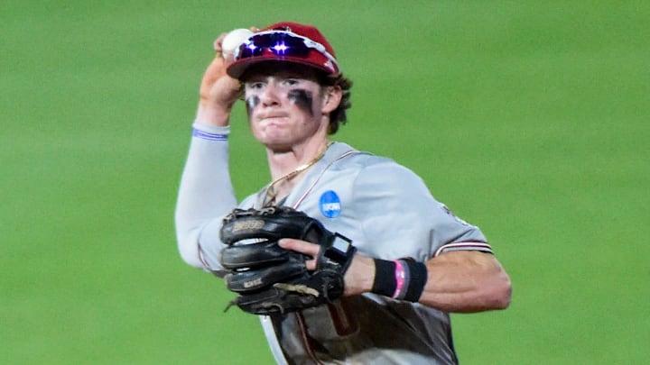 NC State Wolfpack's Luke Nixon (0) turns the double play over Auburn Tigers' Bub Terrell (19) during the NCAA Regional Baseball Tournament at Plainsman Park in Auburn, Ala., on Sunday June 1, 2025.