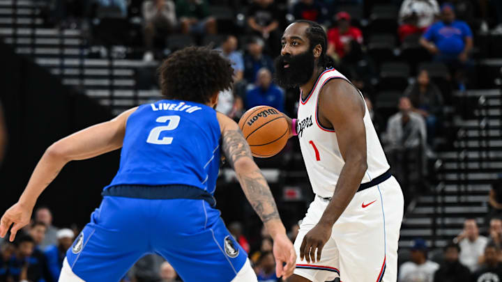 Oct 14, 2024; Inglewood, California, USA; LA Clippers guard James Harden (1) looks to pass against Dallas Mavericks center Dereck Lively II (2) during the first half at Intuit Dome. Mandatory Credit: Jonathan Hui-Imagn Images