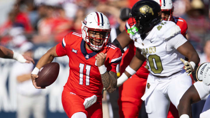 Oct 19, 2024; Tucson, Arizona, USA; Arizona Wildcats quarterback Noah Fifita (11) against the Colorado Buffalos at Arizona Stadium. Mandatory Credit: Mark J. Rebilas-Imagn Images Oct 19, 2024; Tucson, Arizona, USA; Arizona Wildcats quarterback Noah Fifita (11) against the Colorado Buffalos at Arizona Stadium. Mandatory Credit: Mark J. Rebilas-Imagn Images