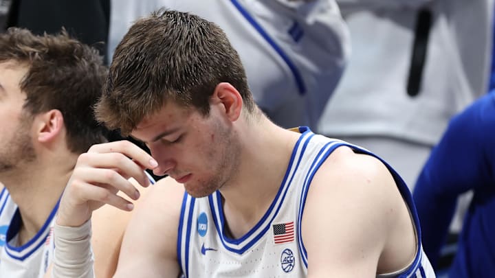 Mar 31, 2024; Dallas, TX, USA; Duke Blue Devils center Ryan Young (15) and center Kyle Filipowski (30) react from the bench in the second half against the North Carolina State Wolfpack in the finals of the South Regional of the 2024 NCAA Tournament at American Airline Center. Mandatory Credit: Tim Heitman-USA TODAY Sports