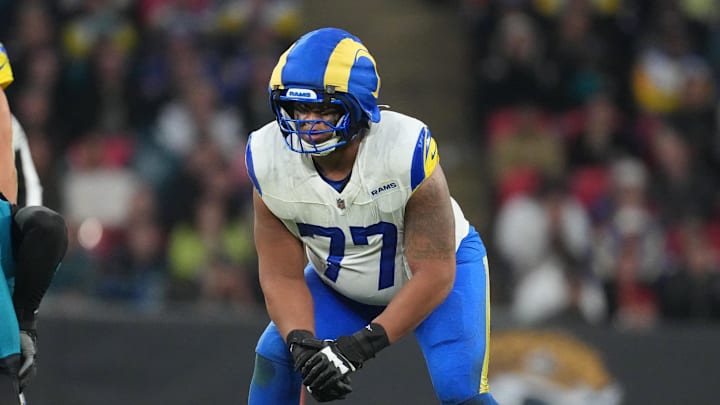 Oct 19, 2025; London, United Kingdom; Los Angeles Rams offensive tackle Alaric Jackson (77) before a snap against the Jacksonville Jaguars during the second half of an NFL International Series game at Wembley Stadium. Mandatory Credit: Kirby Lee-Imagn Images Oct 19, 2025; London, United Kingdom; Los Angeles Rams offensive tackle Alaric Jackson (77) before a snap against the Jacksonville Jaguars during the second half of an NFL International Series game at Wembley Stadium. Mandatory Credit: Kirby Lee-Imagn Images