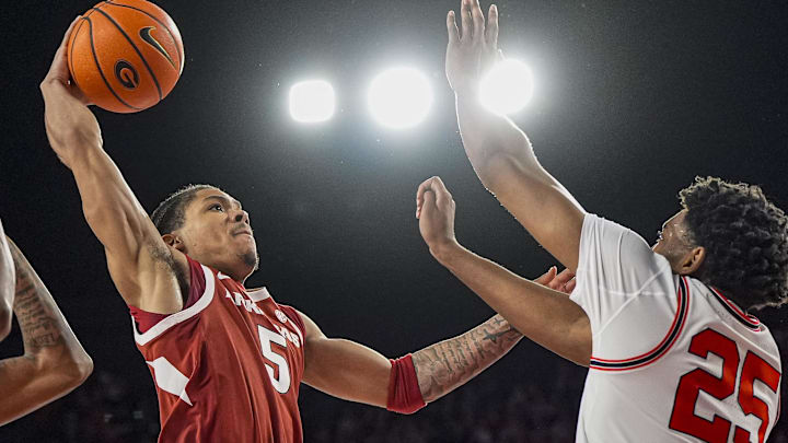 Arkansas Razorbacks guard Darius Acuff Jr. (5) tries to get to the basket against Georgia Bulldogs forward Justin Abson (25) during the second half at Stegeman Coliseum in Athens, Ga.
