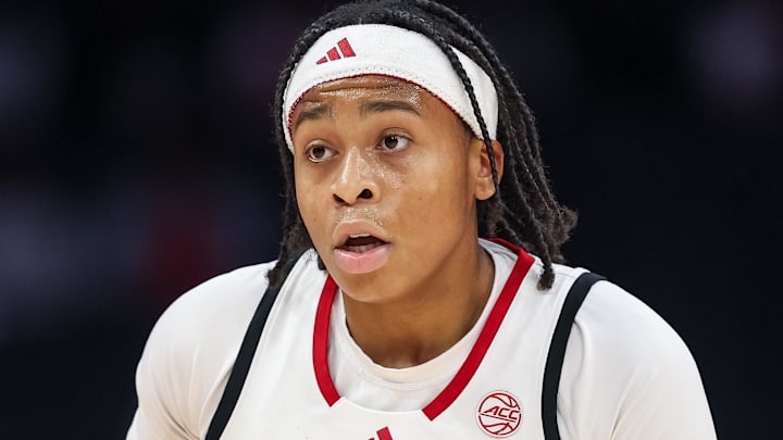 Nov 9, 2025; Charlotte, North Carolina, USA; NC State Wolfpack guard Zoe Brooks (35) dribbles the ball against the Southern California Trojans during the first quarter of the Ally Tipoff game at Spectrum Center. Mandatory Credit: Cory Knowlton-Imagn Images