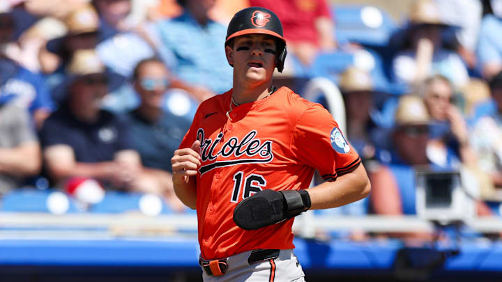Mar 13, 2025; Dunedin, Florida, USA; Baltimore Orioles third baseman Coby Mayo (16) scores a run against the Toronto Blue Jays in the second inning during spring training at TD Ballpark