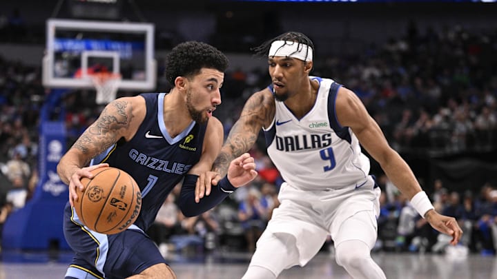 Oct 7, 2024; Dallas, Texas, USA; Memphis Grizzlies guard Scotty Pippen Jr. (1) drives to the basket past Dallas Mavericks guard A.J. Lawson (9) during the second half at the American Airlines Center. Mandatory Credit: Jerome Miron-Imagn Images