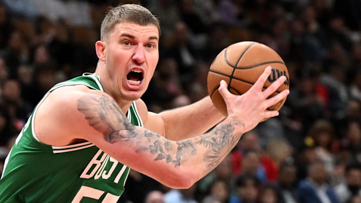 Oct 10, 2025; Toronto, Ontario, CAN; Boston Celtics forward Baylor Scheierman (55) moves the ball past Toronto Raptors guard Alijah Martin (55) in the first half at Scotiabank Arena. Oct 10, 2025; Toronto, Ontario, CAN; Boston Celtics forward Baylor Scheierman (55) moves the ball past Toronto Raptors guard Alijah Martin (55) in the first half at Scotiabank Arena.
