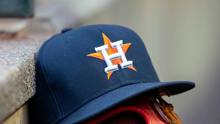 A general view of a Houston Astros hat and glove in the dugout during the fifth inning against the Minnesota Twins at Target Field. Mandatory Credit: Jesse Johnson-Imagn Images