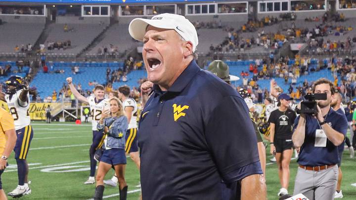 Sep 19, 2026; Charlotte, North Carolina, USA; West Virginia Mountaineers head coach Rich Rodriguez celebrates after defeating the Virginia Cavaliers at Bank of America Stadium. Mandatory Credit: Ben Queen-Imagn Images