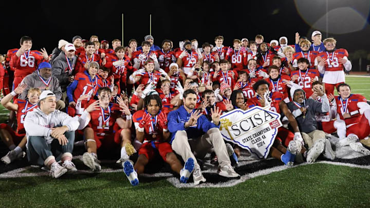 Hammond football celebrates its 8th consecutive SCISA football state championship after its 28-21 victory over Porter-Gaud.