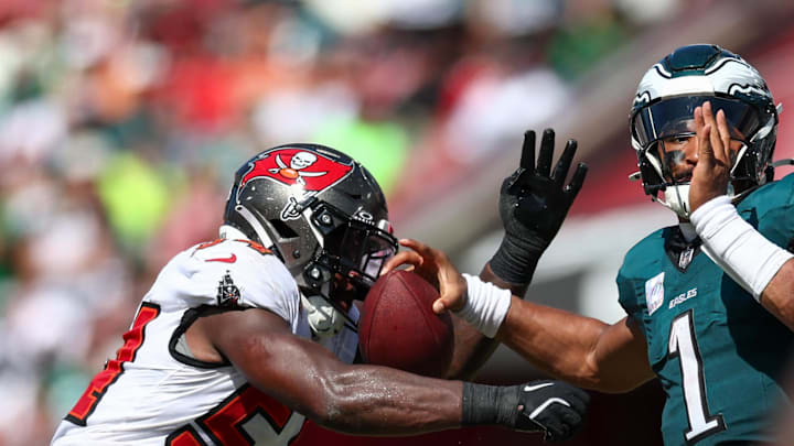 Tampa Bay Buccaneers linebacker Lavonte David (54) records a strip-sack against Philadelphia Eagles quarterback Jalen Hurts (1).