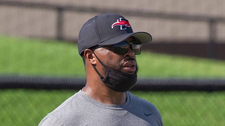 Southeastern University wide receivers coach Johnnie Mack evaluates his players during the teamÕs first practice at Victory Field in Lakeland Saturday. Mack is a former Lakeland High School player and helped and was a member of the schoolÕs 1999 State Championship team. August 15, 2020. MICHAEL WILSON | LEDGER CORRESPONDENT Southeastern University wide receivers coach Johnnie Mack evaluates his players during the teamÕs first practice at Victory Field in Lakeland Saturday. Mack is a former Lakeland High School player and helped and was a member of the schoolÕs 1999 State Championship team. August 15, 2020. MICHAEL WILSON | LEDGER CORRESPONDENT