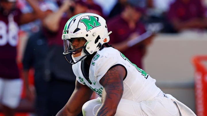 Sep 7, 2024; Blacksburg, Virginia, USA; Marshall Thundering Herd defensive lineman Mike Green (15) celebrates after sacking Virginia Tech Hokies quarterback Kyron Drones (1) during the first quarter at Lane Stadium. Mandatory Credit: Peter Casey-Imagn Images Sep 7, 2024; Blacksburg, Virginia, USA; Marshall Thundering Herd defensive lineman Mike Green (15) celebrates after sacking Virginia Tech Hokies quarterback Kyron Drones (1) during the first quarter at Lane Stadium. Mandatory Credit: Peter Casey-Imagn Images