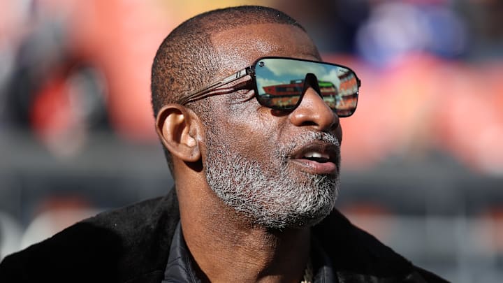 Dec 21, 2025; Cleveland, Ohio, USA;  Legendary  football and baseball player and father of Cleveland Browns quarterback Shedeur Sanders, Deion Sanders on the sidelines prior to a game against the Buffalo Bills at Huntington Bank Field. Mandatory Credit: Scott Galvin-Imagn Images