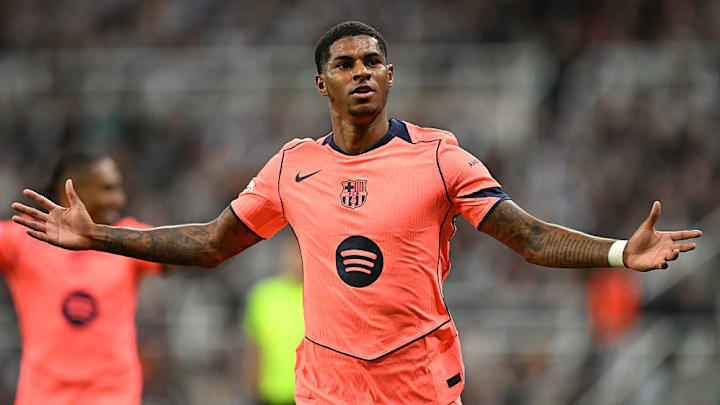 Marcus Rashford celebrates his second strike for Barcelona in this statement win.