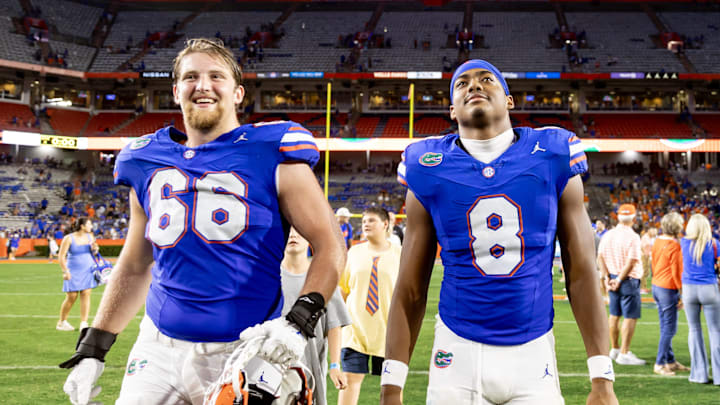 Florida Gators offensive lineman Jake Slaughter (66) and Florida Gators tight end Arlis Boardingham (8).