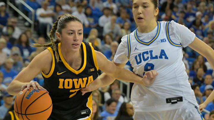 Feb 1, 2026; Los Angeles, California, USA;  Iowa Hawkeyes guard Addie Deal (7) is defended by UCLA Bruins guard Lena Bilic (9) in the second half at Pauley Pavilion presented by Wescom Financial. Mandatory Credit: Jayne Kamin-Oncea-Imagn Images