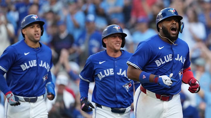 Toronto Blue Jays first baseman Vladimir Guerrero Jr. (27) celebrates with teammates after hitting a grand slam in the fourth inning against the New York Yankees during game two of the ALDS round for the 2025 MLB playoffs at Rogers Centre. Toronto Blue Jays first baseman Vladimir Guerrero Jr. (27) celebrates with teammates after hitting a grand slam in the fourth inning against the New York Yankees during game two of the ALDS round for the 2025 MLB playoffs at Rogers Centre.