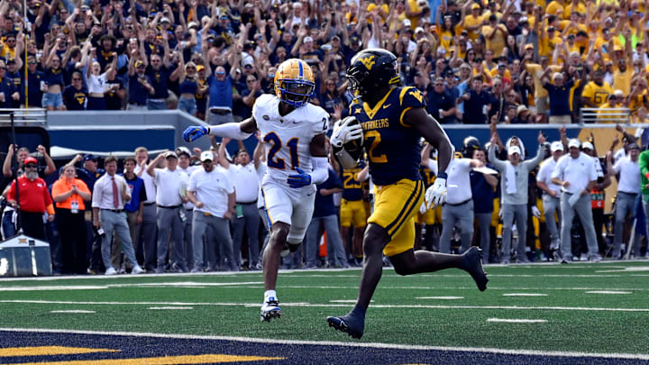 WVU running back Tye Edwards rushes for a touchdown against the Pitt Panthers during The Backyard Brawl at Milan Puskar Stadium in Morgantown, W.Va.