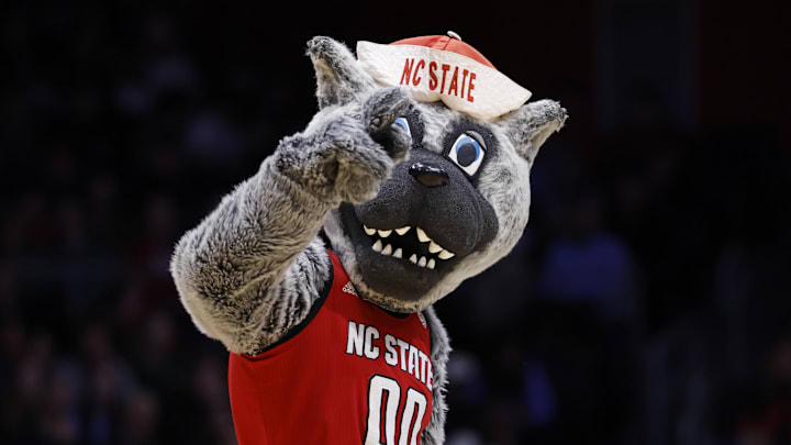 Mar 17, 2026; Dayton, OH, USA; The NC State Wolfpack mascot “Mr. Wuf” performs in the first half against the Texas Longhorns during a first four game of the men's 2026 NCAA Tournament at University of Dayton Arena. Mandatory Credit: Rick Osentoski-Imagn Images
