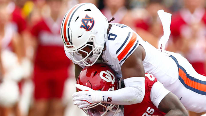 Auburn Tigers linebacker Robert Woodyard Jr. tackles Oklahoma Sooners running back Tory Blaylock Auburn Tigers linebacker Robert Woodyard Jr. tackles Oklahoma Sooners running back Tory Blaylock