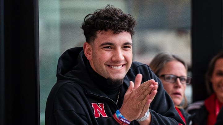 Nov 28, 2025; Lincoln, Nebraska, USA; Nebraska Cornhuskers quarterback Dylan Raiola (15) greets the team as the walk into the stadium before the game against the Iowa Hawkeyes at Memorial Stadium. Mandatory Credit: Dylan Widger-Imagn Images