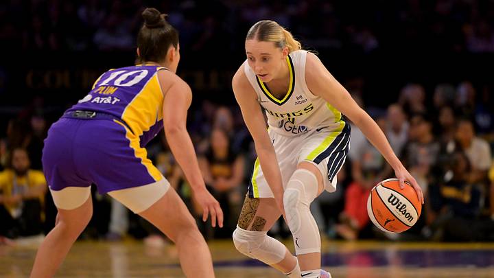 Sep 7, 2025; Los Angeles, California, USA;  Los Angeles Sparks guard Kelsey Plum (10) defends Dallas Wings guard Paige Bueckers (5) as she drives to the basket during the first half at Crypto.com Arena. Mandatory Credit: Jayne Kamin-Oncea-Imagn Images