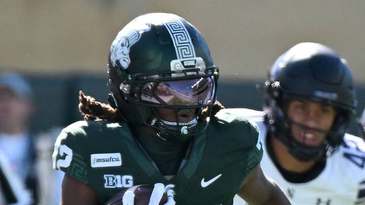 Oct 17, 2026; East Lansing, Michigan, USA;  Michigan State Spartans running back Kenneth Williams (32) sprints upfield for a first down against the Northwestern Wildcats during the first quarter at Spartan Stadium.  Mandatory Credit: Dale Young-Imagn Images
