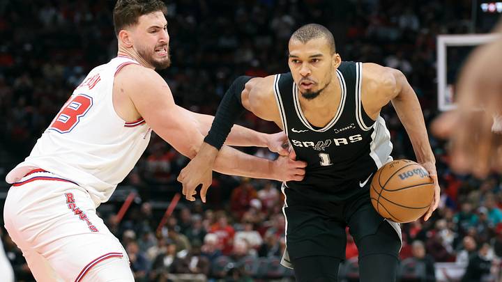 Jan 28, 2026; Houston, Texas, USA; San Antonio Spurs forward Victor Wembanyama (1) controls the ball as Houston Rockets center Alperen Sengun (28) defends during the third quarter at Toyota Center. Mandatory Credit: Troy Taormina-Imagn Images