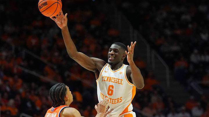 Tennessee forward DeWayne Brown II (6) passes the ball in front of Auburn's Elyjah Freeman (6) during a NCAA basketball game between the Tennessee Volunteers and Auburn Tigers at Thompson-Boling Arena at Food City Center in Knoxville, Tenn., on Jan. 31, 2026.